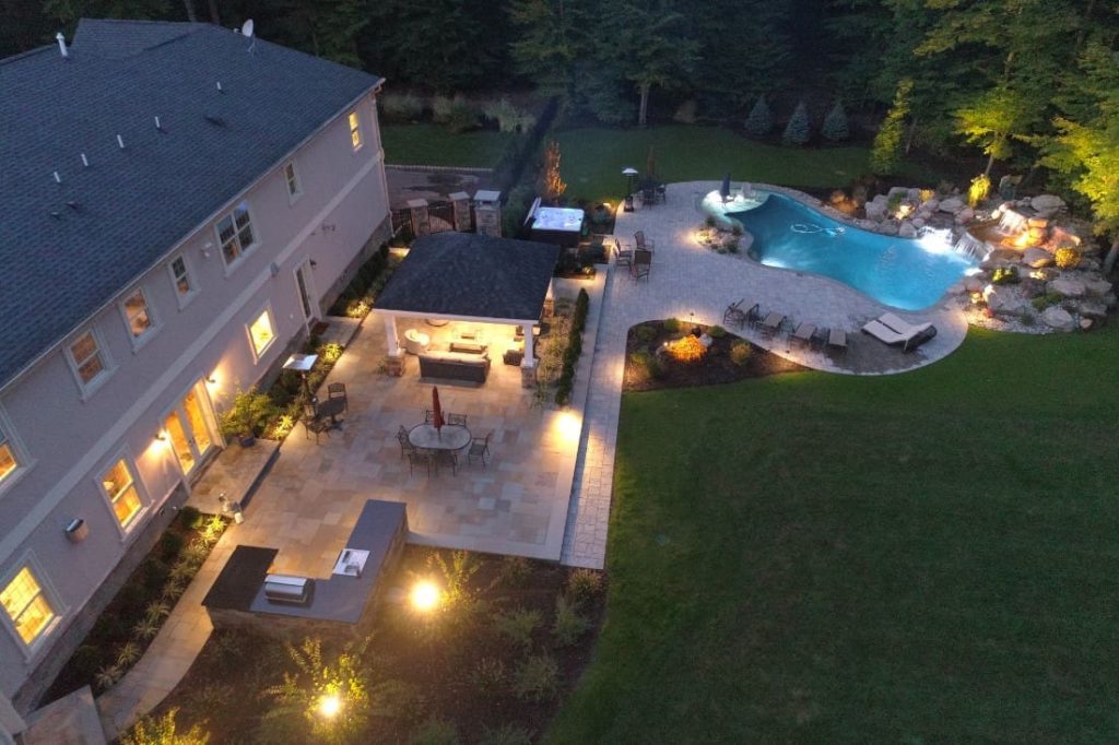 Beautifully illuminated home exterior with professional landscape lighting in Palm Coast, FL