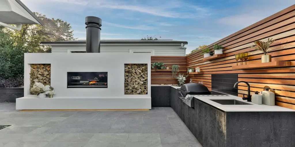 Custom Built-In Outdoor Kitchen + Fireplace Combo